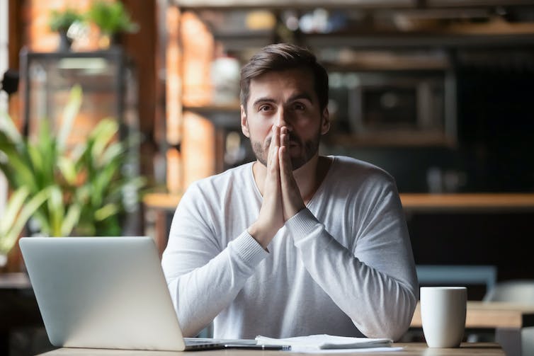 A man sitting at a keyboard.