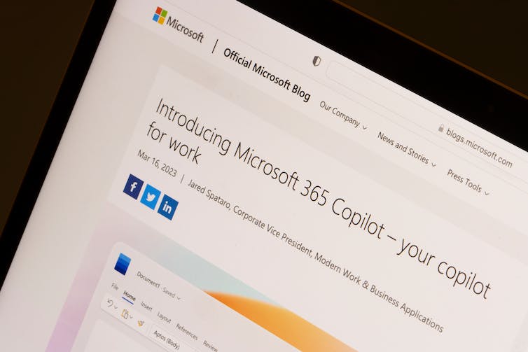 A close-up of a laptop screen, which has a window open with information about Microsoft's 365 Copilot software.