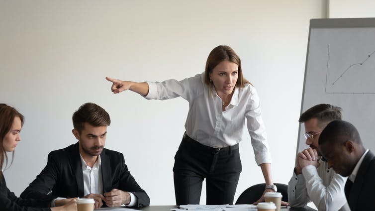 Female boss manager shout firing sad stressed male worker.